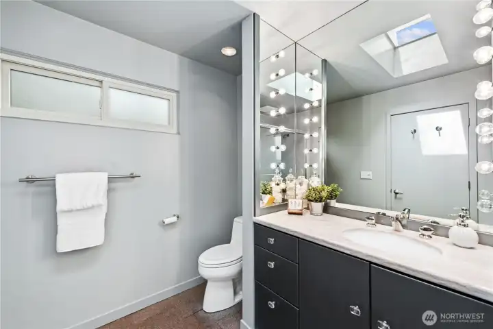 Private ensuite bath with ample space and functionality, serving as a quiet retreat within the home.