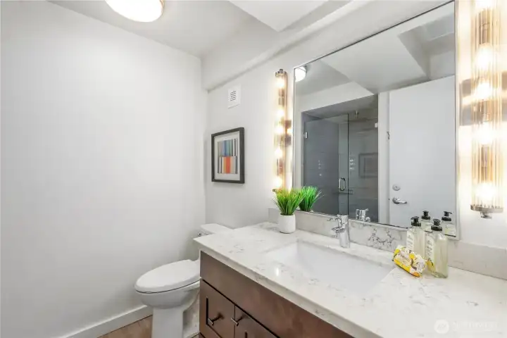 Updated tiled bathroom in ADU with modern finishes and efficient design.