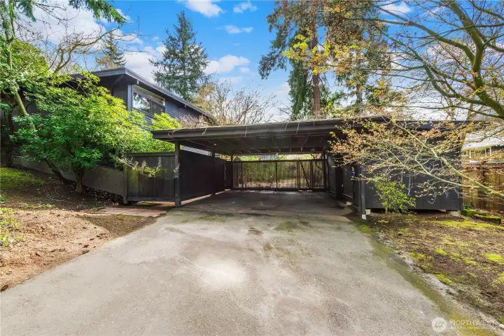 Covered 2-car carport with EV charging and additional storage—functional and future-ready.