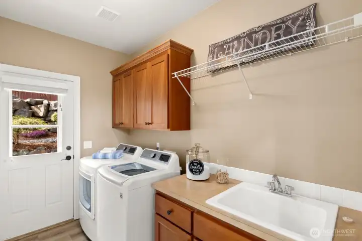 Laundry room with patio / backyard access.