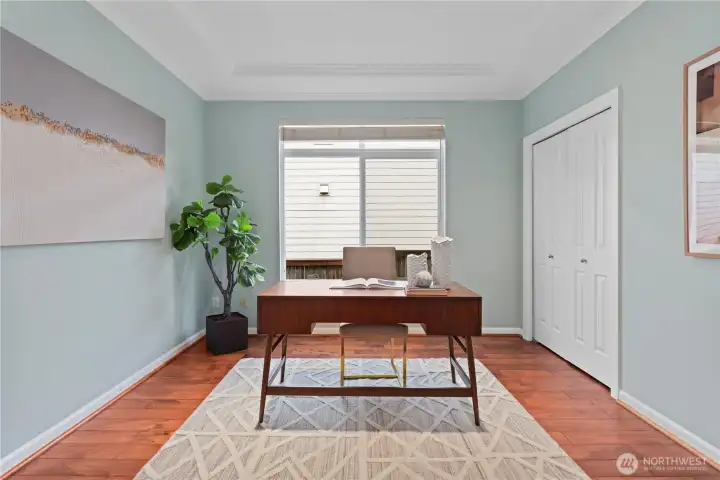 Main floor office/den with French doors, and main floor powder room next door.