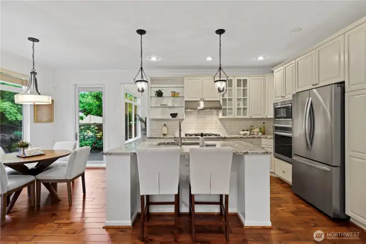 Kitchen with beautiful quartz countertops, pull out shelving in cabinets and designer touches.