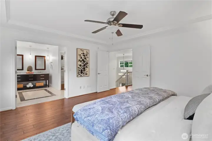 Primary bedroom with a view into the spa-like bathroom
