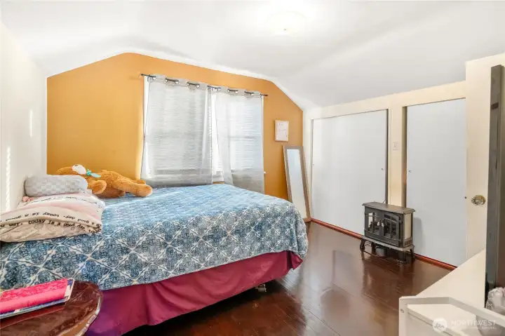 Primary bedroom with private bathroom on upper floor