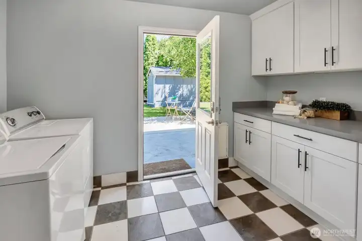 Large laundry room with newer cabinetry