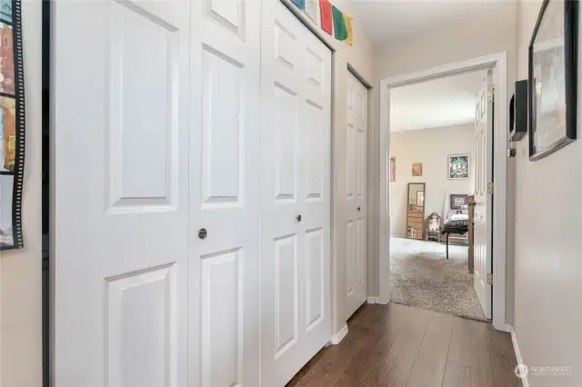 Closet doors opens up to laundry.