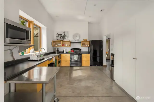 The full-size kitchen in the community center is a fantastic amenity and is perfect for hosting events, cooking classes, and community gatherings.