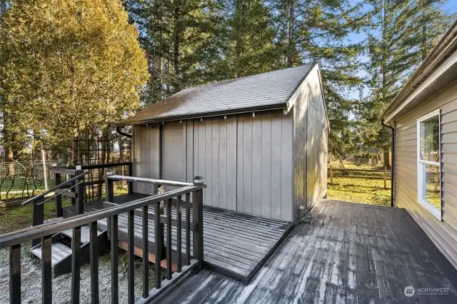 The finished detached shed adds flexibility—ideal for a home office, den, or creative retreat.