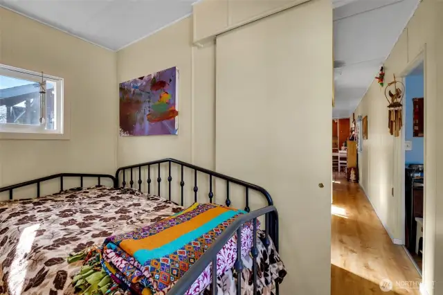 Spacious primary bedroom at south end of home