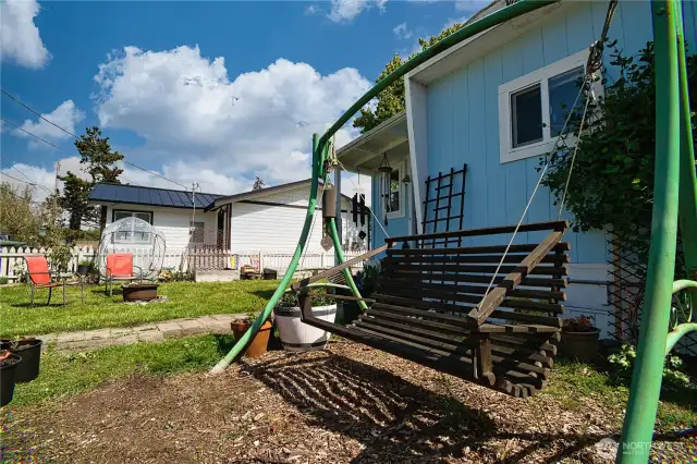 Front of home with lounge swing!