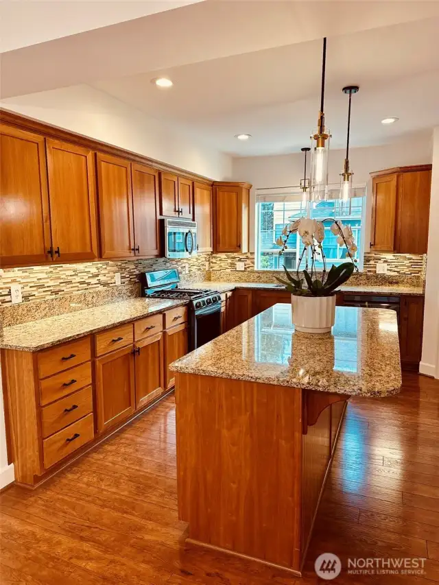 Extra large Island. This kitchen is super spacious with loads of cabinets and walk-in pantry.  New hot water heater in garage. (2021)