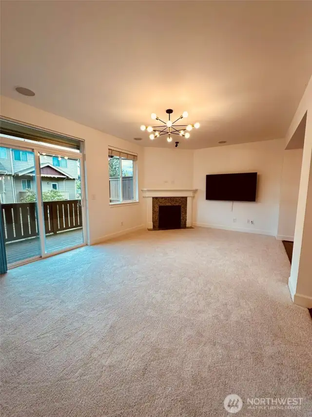 Deck off Extra large Great Room overlooking green open space, deck faces North, New carpet, new paint and new art lighting above fireplace. New designer chandelier.