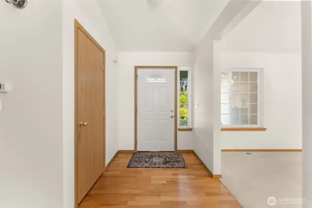 Foyer with dining room on your right and primary suite on your left