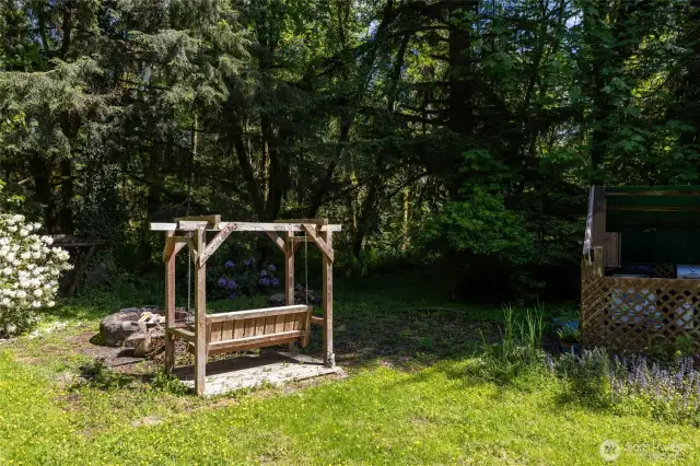 Swing next to your fire-pit next to the stream that flows into the S Fork of the Newakum river