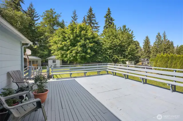 Wood Deck with Seating Facing the Back Yard Privacy. Entertainment Size