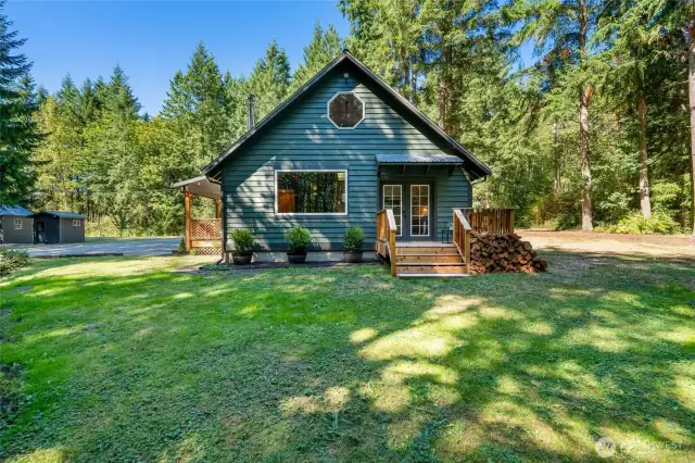 Charming 2-bed, 2-bath home on 5+ private wooded acres, offering comfort, privacy, and space to thrive
