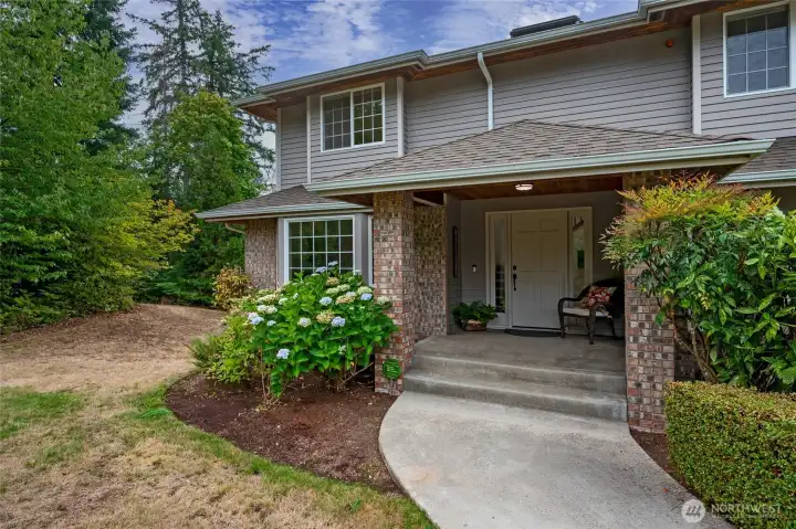 Large covered front porch entry to welcome you home