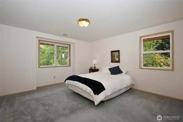 Spacious primary suite with ensuite 5 piece bath and walk-in closet