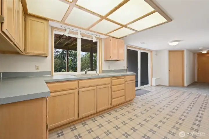 Lower level kitchenette perfect for parties opens to large patio, rec room, and two extra finished rooms