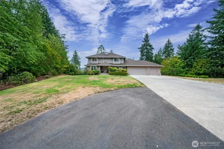 Long driveway and room for RV parking access to 3-car garage