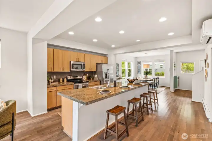 Your grand kitchen island with tons of space to eat at the breakfast bar or in the adjacent dining room.