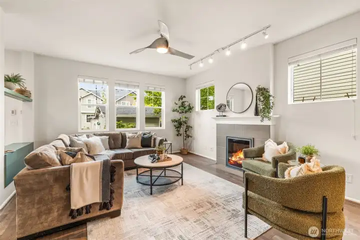 Your sprawling, bright living room offers a cozy electric fireplace and hardwood floors. Modern touches while inviting and warm!