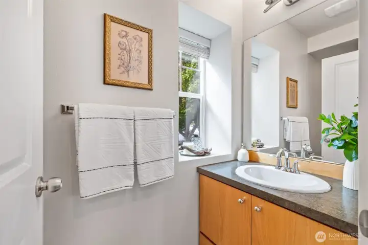 A convenient half bathroom sits just off of your living room.