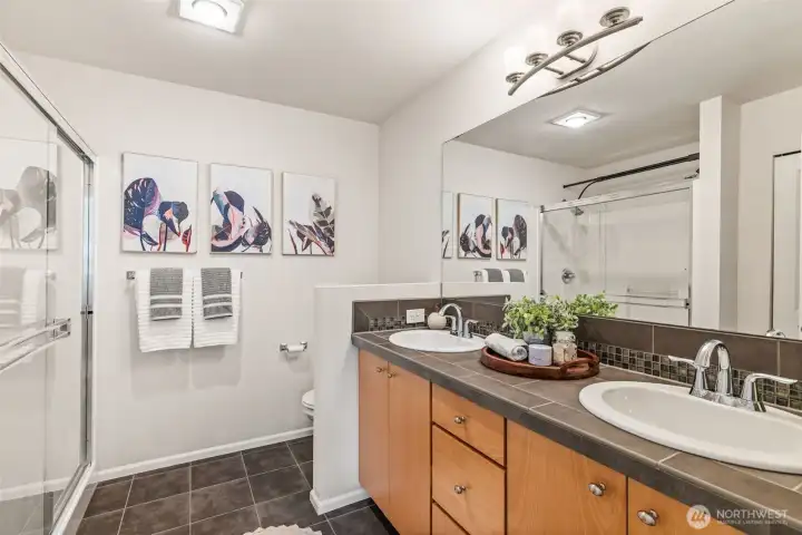Your en suite master bathroom offers dual sinks, an over-sized shower and incredible storage - more of which is out of frame!