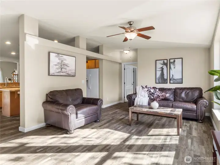 Upon entering you are immediately greeted by a spacious living room with plenty of natural light