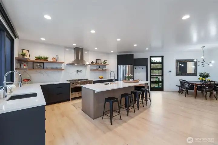 View from living room looking on to kitchen and dining area w/ a pantry.