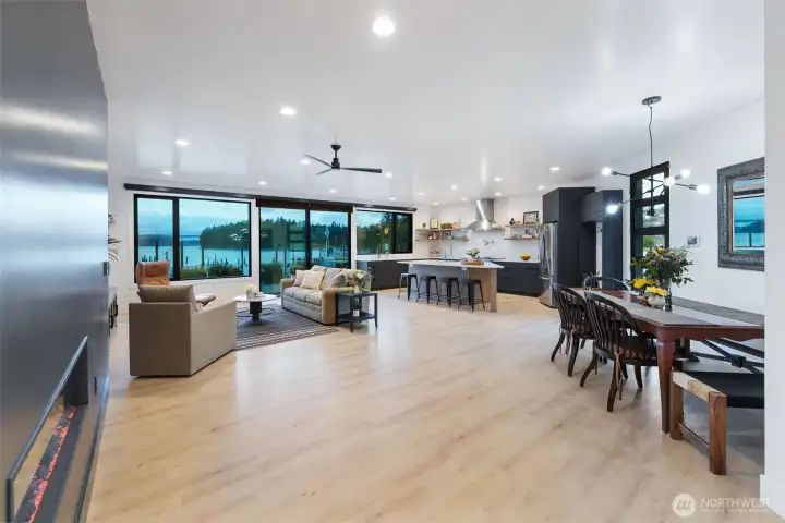 Electric fireplace and view of the main floor. The door to the right is an entrance to the courtyard.