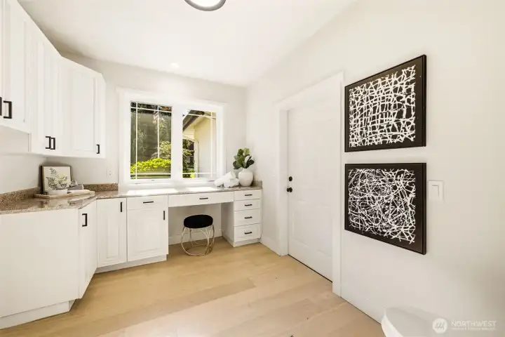 Laundry room is just off the kitchen and doubles as a mud room entering into the garage.