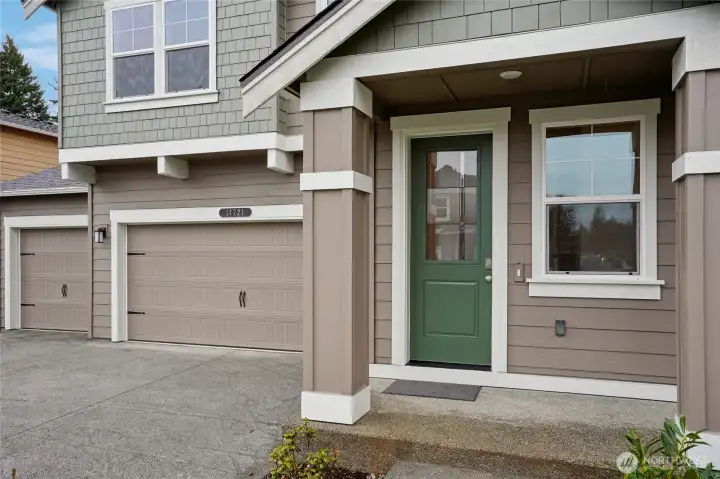 Beautiful neutral exterior with peaceful green door.