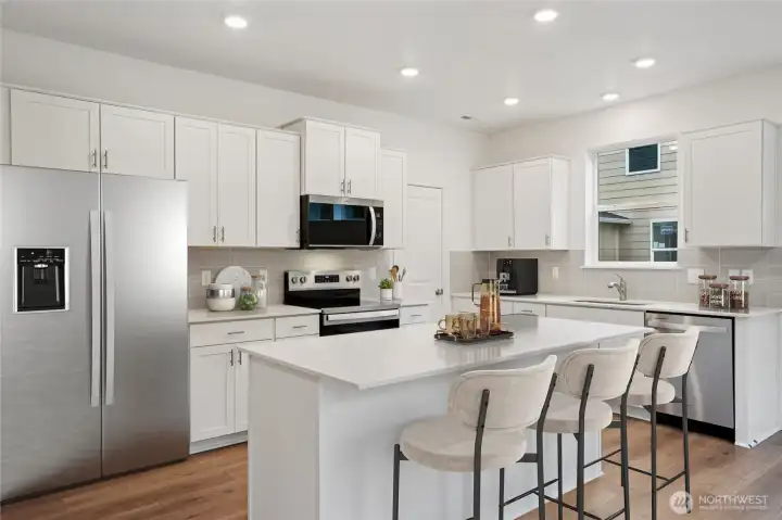 Endless cabinet space, walk-in pantry, soft close cabinets, stainless steel appliances all making your kitchen dreams come true.   Pictures are for representational purposes only, colors and features may vary.