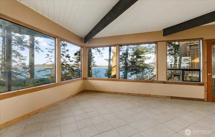Enjoy wraparound views from the Lower Level Sunroom.