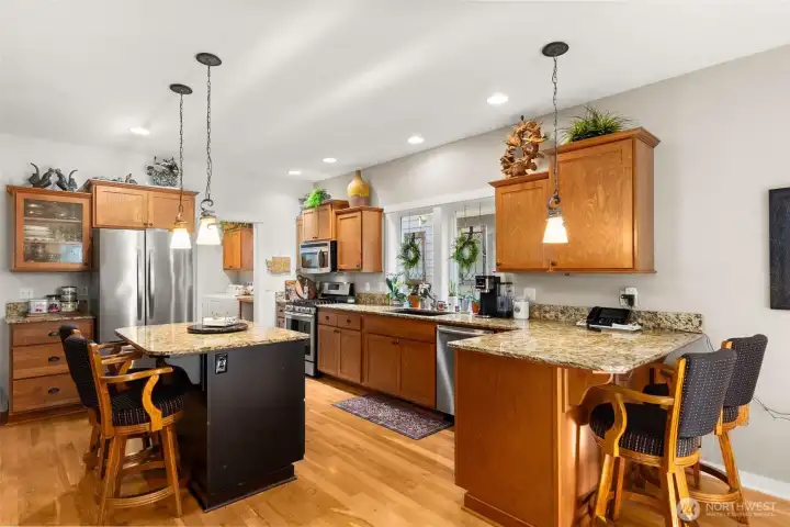 Straight from the garage to the kitchen with ease. Stainless appliances, granite countertops, & beautiful conversation areas.