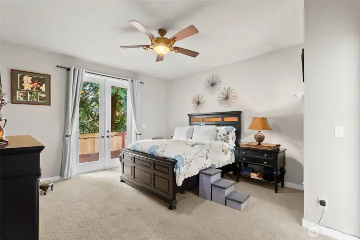 Your spacious Primary Bedroom retreat - the perfect place to begin and end your day. And you also have access to your back deck!