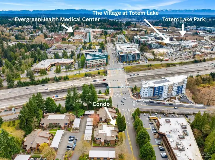 Aerial view of the condo in relation to the Village at Totem Lake, Totem Lake Park and EvergreenHealth Medical Center.