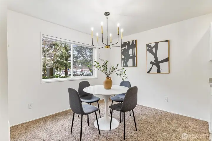 The dining room offers the perfect blend of functionality and charm, featuring ample space for a dining set and decor.