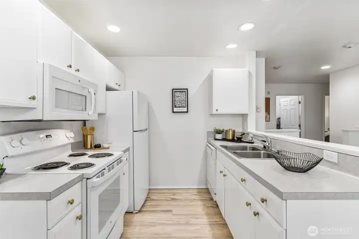 Open-concept design flows effortlessly into the dining and living areas, making meal prep a delight.