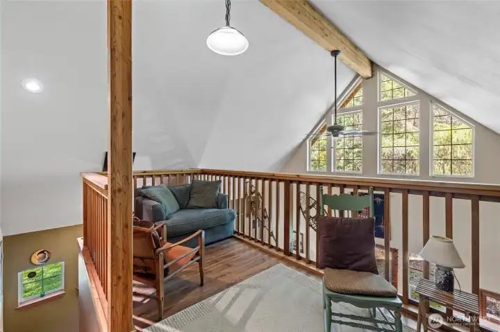 Loft area looking out spacious windows