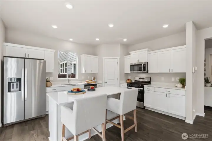 This solid surface island is ideal for baking or food prep! Pictures are for representation only as colors and options will vary.