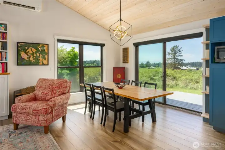 Past the dining table through the sliding door to the Trex deck.