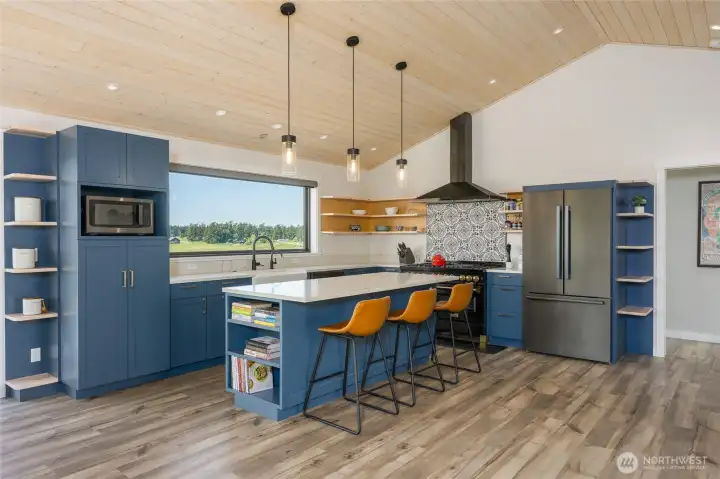 Chef's kitchen features Zline 6 burner stove, Bosch refrigerator and farm sink.