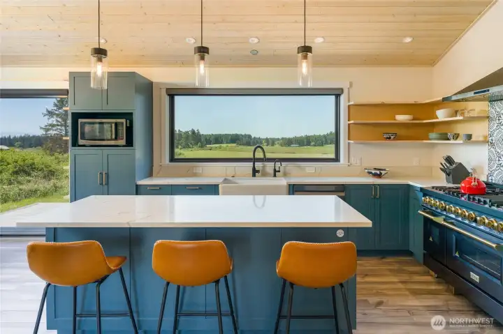 Looking across the 7 foot quartz island with the Zline stove on the right.