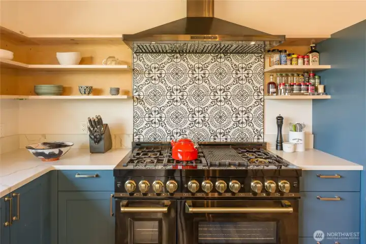 Zline 6 burner plus griddle propane range has double ovens.