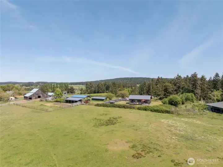 House for sale has the red umbrella.