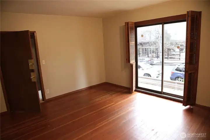 The front, bottom apt is unit 1 and large living space with balcony The front, bottom apt is unit 1 and large living space with balcony
