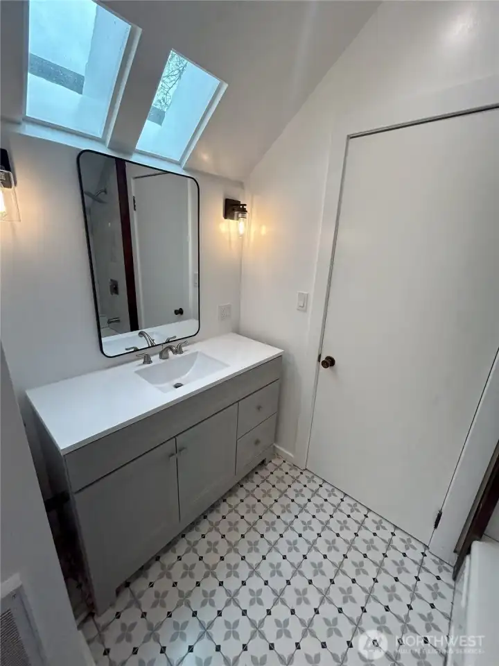 Unit 4's skylit bath Unit 4's skylit bath