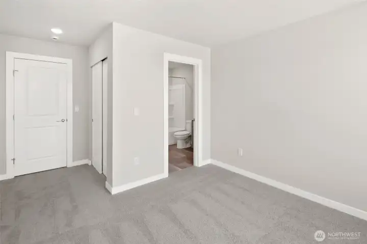 2nd bedroom upstairs, with en-suite bath & TWO closets!